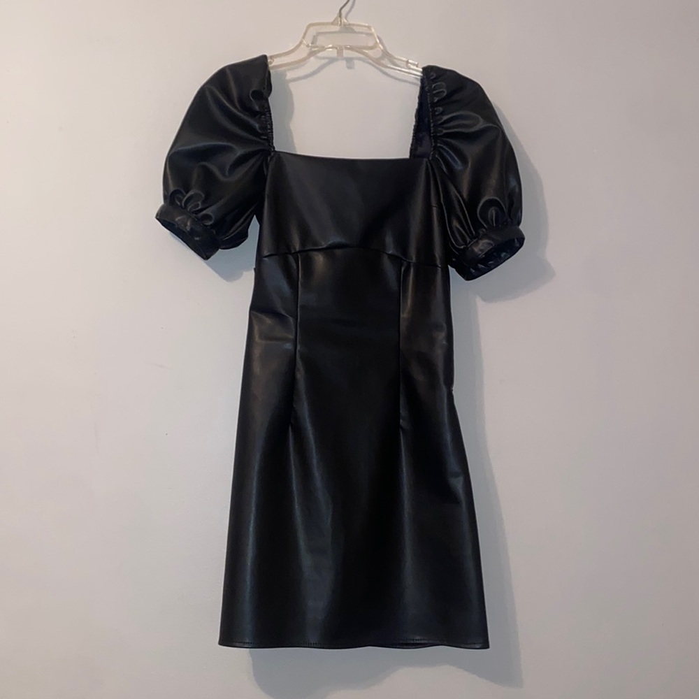 Mini, black faux leather dress. Backless